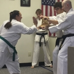 Breaking boards with palm strike